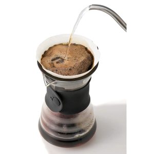 Hot water being poured over coffee grounds into a Hario V60, Merchandise - Tin Cup Coffee Company Nashville, TN